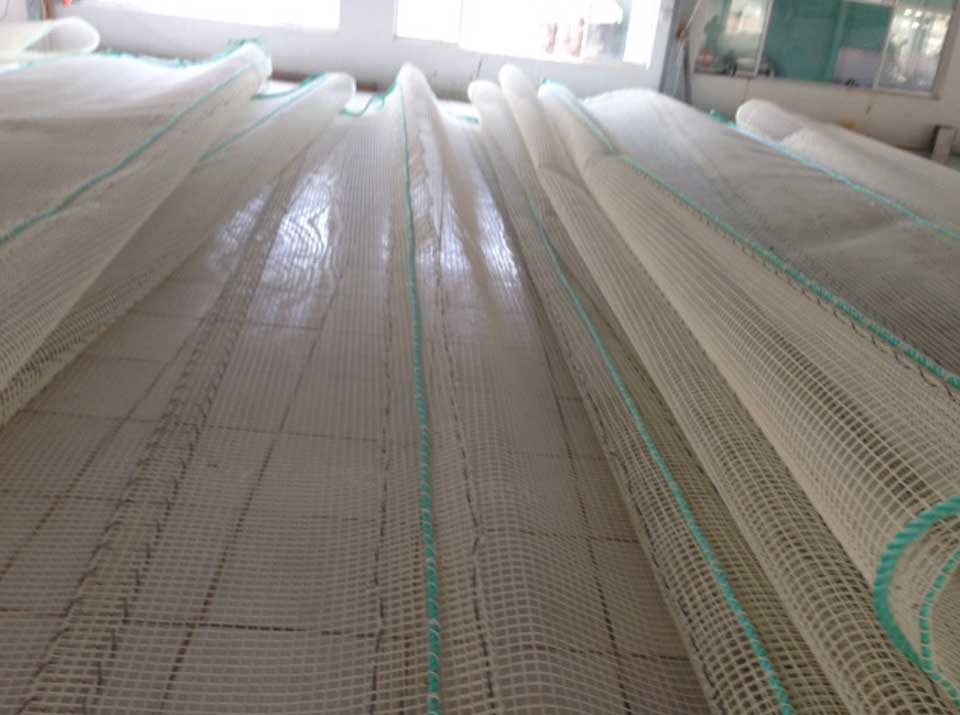 Rolled KGrid net panels stacked in the workshop