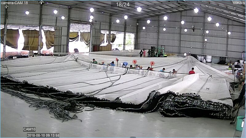 Workshop team assembling a large KGrid net